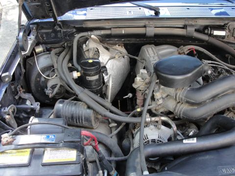 1967 Ford Mustang - Close-up view of a truck's engine compartment, highlighting the complex network of mechanical components.
