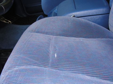 1967 Ford Mustang - Interior view of a car's blue patterned seat and center console.