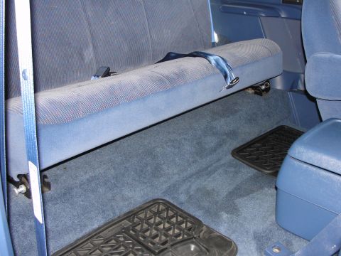 1967 Ford Mustang - Vehicle interior showing the rear bench seat and floor mats.