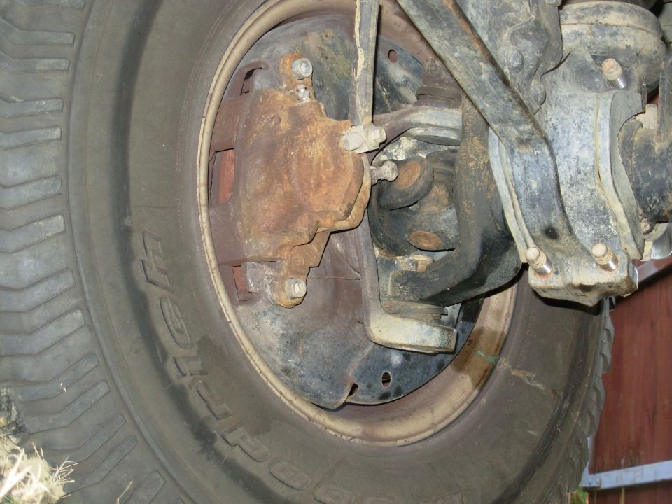 Dude also installed this front disk kit, which rubbed the rims.  It also nearly fell off the first time Frank took the truck off-road.  We've since threadlocked all the bolts that came loose, and changed rims.