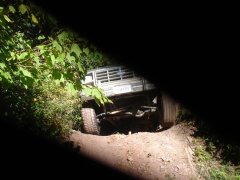 1992 Ford Bronco - This truck appears to be stuck on a challenging off-road trail.