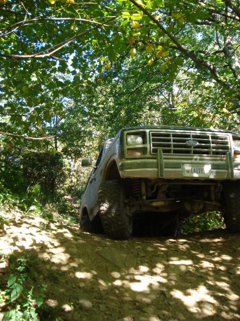 1992 Ford Bronco - This Ford Bronco navigates a challenging off-road path, its capabilities.