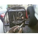 1989 Ford Bronco - A close-up view of a welding machine, likely used for body work, with a tire visible in the background.
