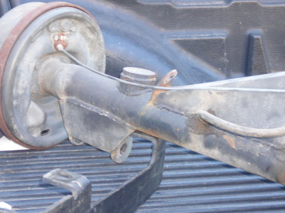 Rear axle assembly with drum brake, possibly from an older truck or SUV