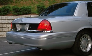 2000 Ford Crown Victoria - Rear view of a silver sedan, showing its taillight and bumper detail.