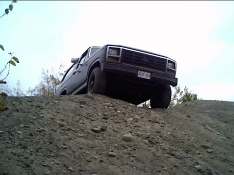 1981 Ford Bronco - This 1981 Ford Bronco is captured mid-climb on a rocky dirt incline.