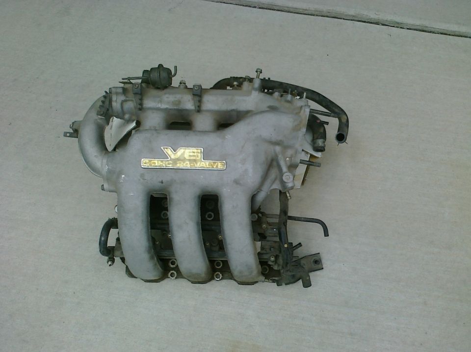 V6 24-valve intake manifold with hoses and sensors attached