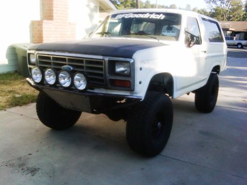 1986 Ford Bronco - This lifted Ford Bronco features a custom bumper and auxiliary lights, giving it an aggressive stance.
