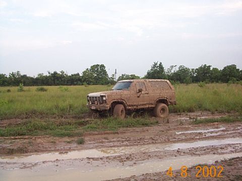 1986 Ford Bronco - This 1980s Ford Bronco is stuck deep in the mud after driving off-road.