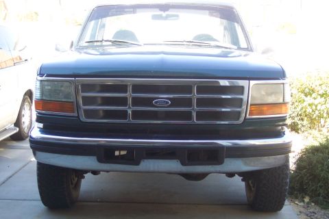 1995 Ford Bronco - Front view of a 1995 Ford Bronco, highlighting its grille and headlight assembly.