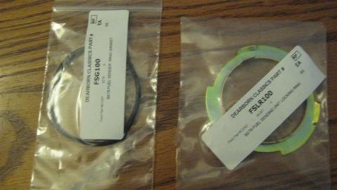 1968 Ford Ranchero - Vehicle parts, including a gasket and a locking ring, are packaged in plastic bags on a wooden surface.