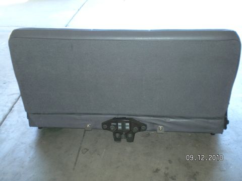 1996 Ford Bronco - Rear seat folded down, showing the latch mechanism and mounting hardware.