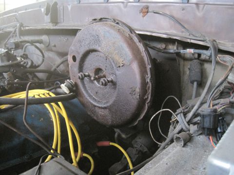 1979 Ford Bronco - Close-up view of engine bay components, including a brake booster and wiring.