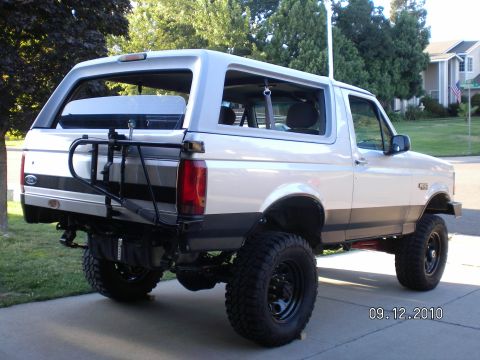 1996 Ford Bronco - Lifted 1996 Ford Bronco shown from the rear, equipped with a spare tire carrier.