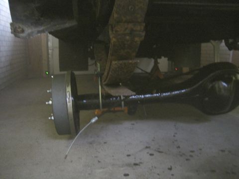 1979 Ford Bronco - Close-up view of a vehicle's rear axle and suspension system.