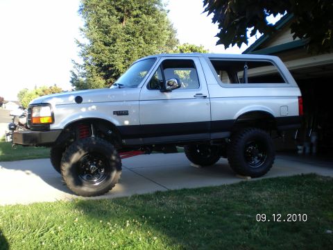 1996 Ford Bronco - This lifted Ford Bronco is parked in a driveway with a garage in the background. The photo was taken on 09.12.2010.