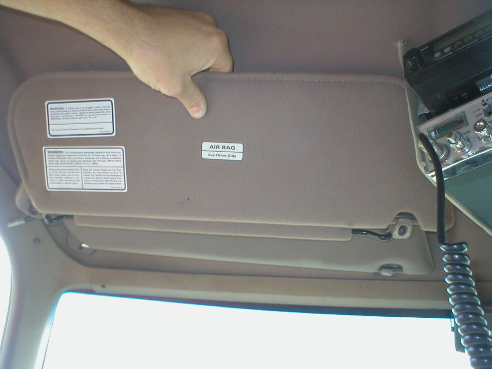 I finally found a set of double visors ('94-96 only) and swapped them in.  I had to trim some metal inside the roof for clearance at the spring, but it was easy and definitely worth it.  Later bodies already have clearance there.