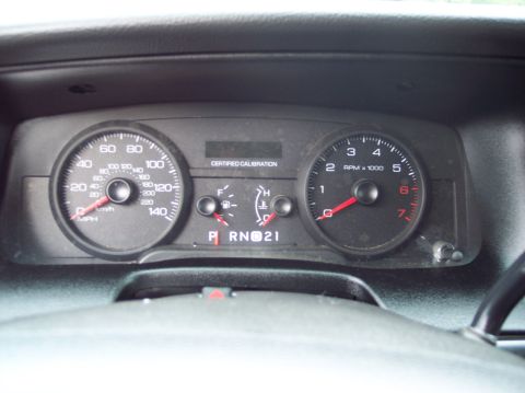 2001 Ford Crown Victoria - Dashboard view of a 2001 Ford Crown Victoria, showing gauges and gear selector.