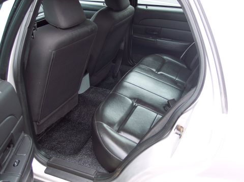 2001 Ford Crown Victoria - Interior view of the rear seating area of a 2001 Ford Crown Victoria police car.