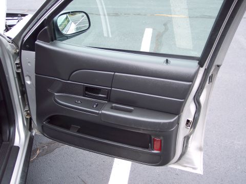 2001 Ford Crown Victoria - Interior view of the driver's side door panel on a 2001 Ford Crown Victoria.