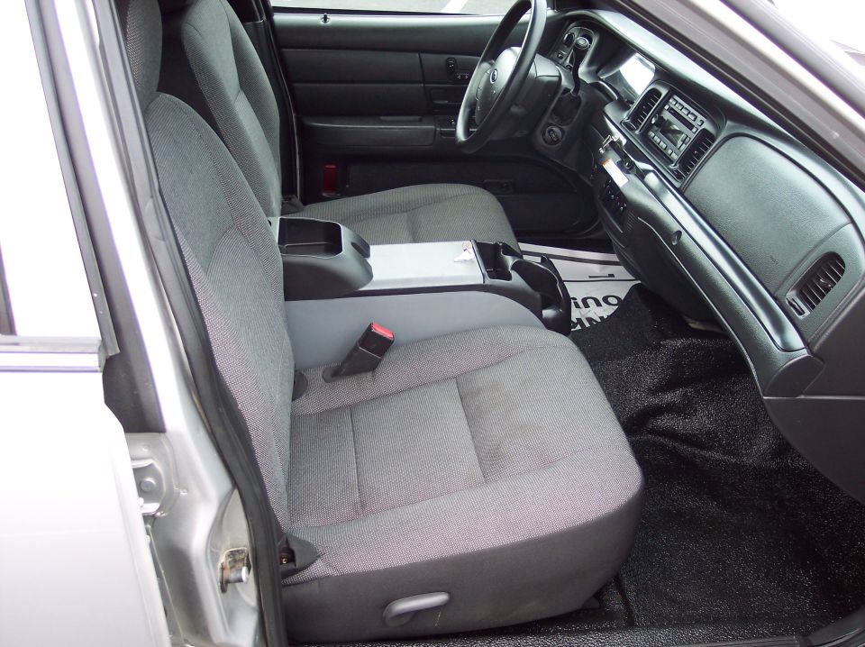 Gray fabric seats and black dashboard of a 2001 Ford Crown Victoria