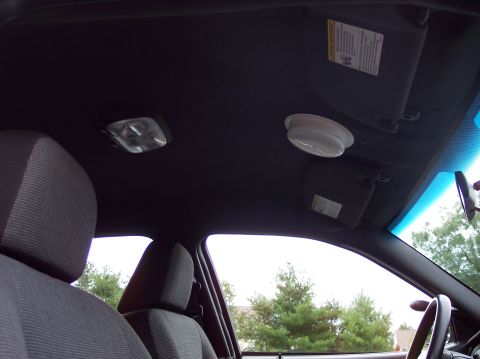 2001 Ford Crown Victoria - Interior view of a 2001 Ford Crown Victoria police car, the headliner, sun visors, and dome light.