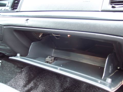 2001 Ford Crown Victoria - Interior view of a 2001 Ford Crown Victoria, focusing on the open glove compartment.