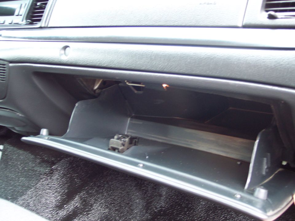 2001 Ford Crown Victoria interior showing the open glove box and dashboard details