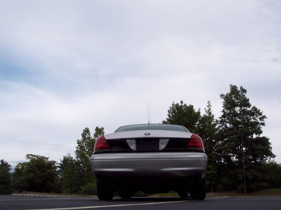 Rear view of a silver 2001 Ford Crown Victoria parked in a lot