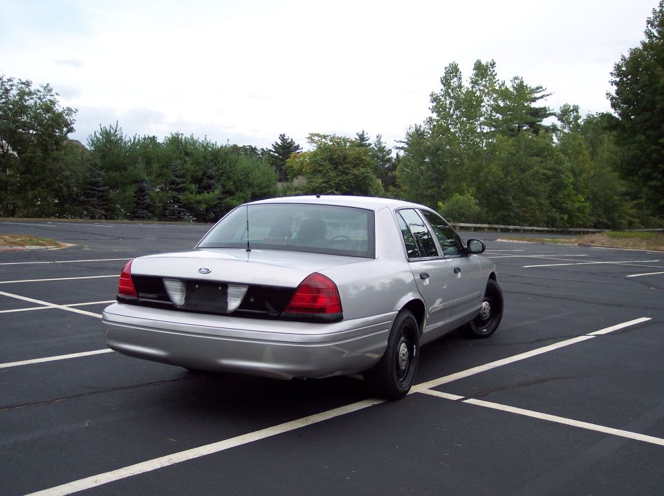 Silver 2001 Ford Crown Victoria sedan, rear view