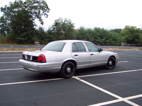 2001 Ford Crown Victoria - Silver 2001 Ford Crown Victoria parked in a lot.