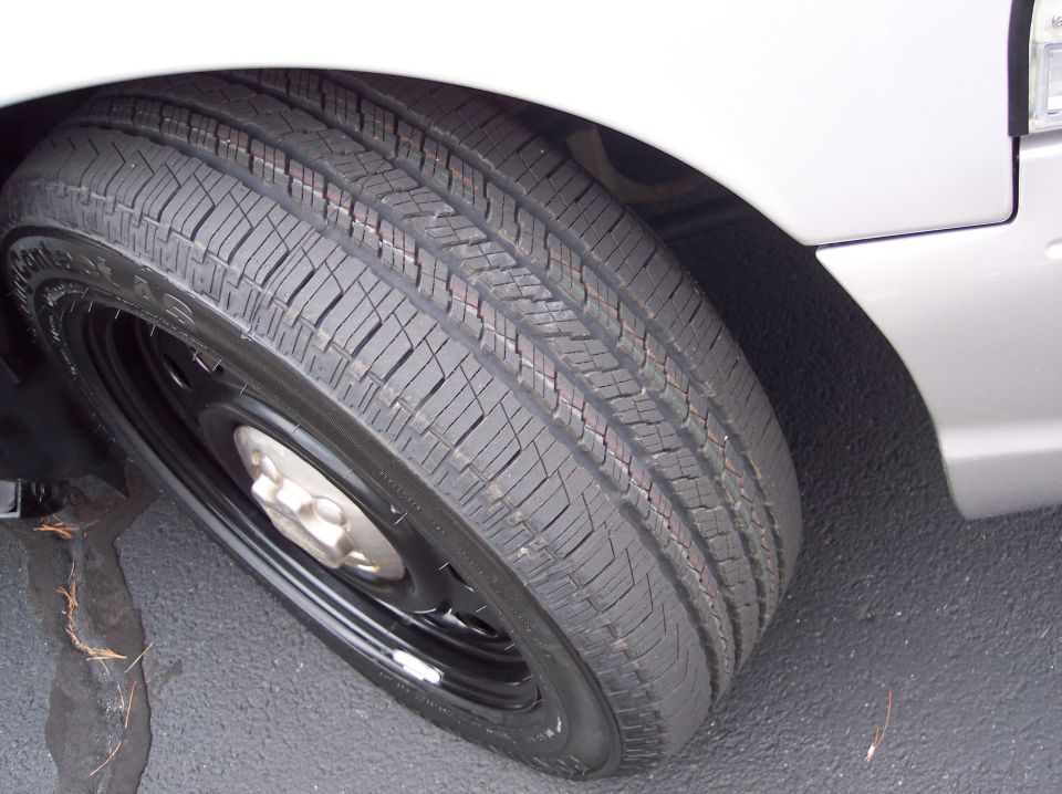 Silver 2001 Ford Crown Victoria wheel and tire