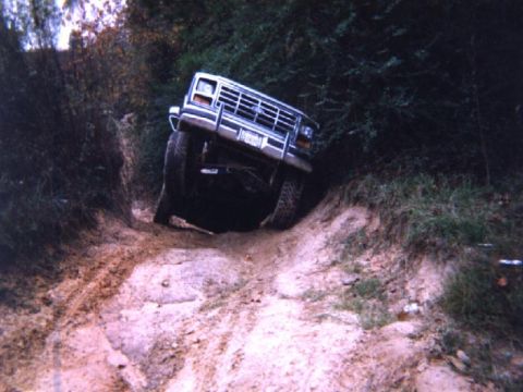 1986 Ford Bronco - This 1986 Ford Bronco is shown tackling a challenging off-road trail.