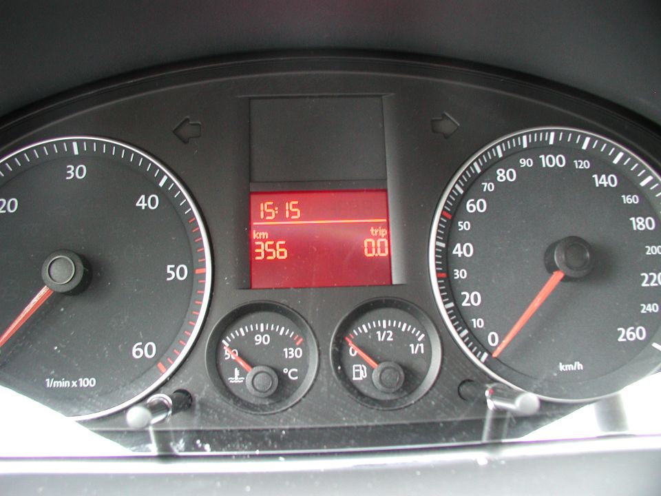 Metric gauge cluster with 260 km/h speedometer and red display showing 356 km