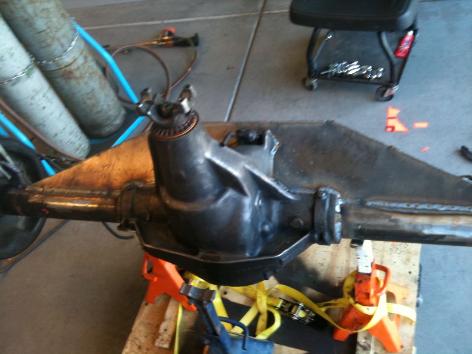 Rear axle assembly on orange jack stands