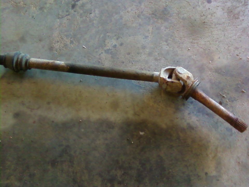 Driveshaft with U-joint, appears rusty