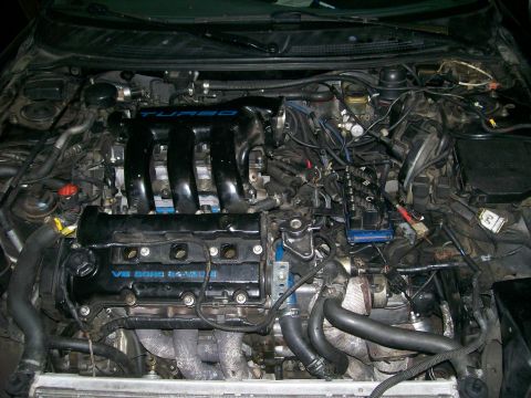 1995 Ford Probe - Engine bay with V6 DOHC 24-VALVE and TURBO labels visible.
