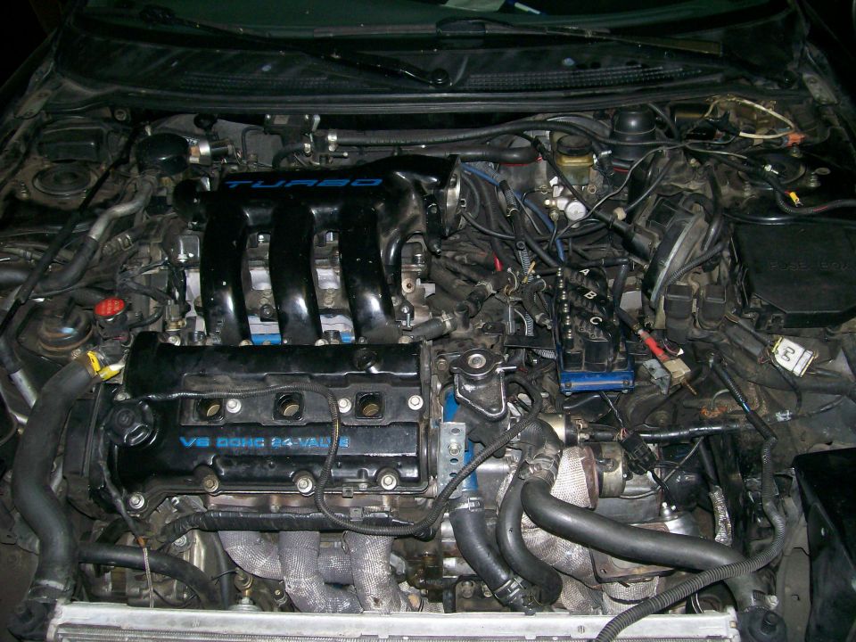 Engine bay with V6 DOHC 24-VALVE and TURBO labels visible