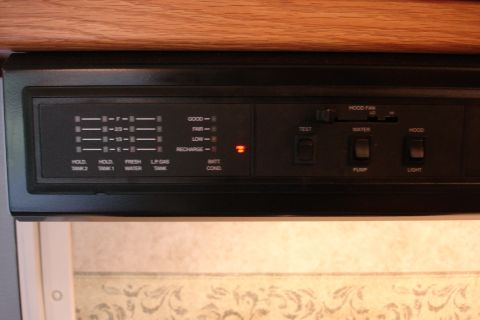 2005 Chevrolet Silverado 3500 - This RV control panel displays tank levels and battery status, with controls for various functions.
