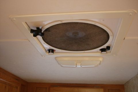 2005 Chevrolet Silverado 3500 - Ceiling vent fan in an RV, showing the fan cover and manual controls.