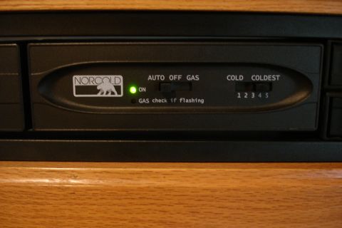 2005 Chevrolet Silverado 3500 - Close-up of a Norcold refrigerator control panel showing power and temperature settings.