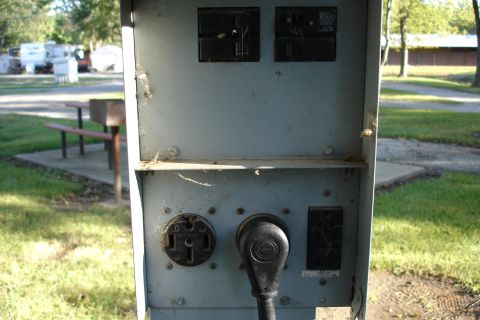 2005 Chevrolet Silverado 3500 - This electrical hookup box is located at a campground with RVs visible in the background.