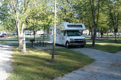 2005 Chevrolet Silverado 3500 - This 2005 Chevrolet Silverado 3500 serves as the chassis for a Four Winds RV motorhome at a campground.