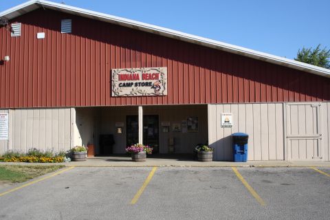 2005 Chevrolet Silverado 3500 - The Indiana Beach Camp Store building is seen under a clear blue sky.