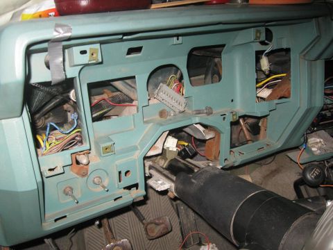1981 Ford Bronco - Interior view of a vehicle's dashboard with wiring exposed during a repair or modification.