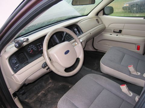 1991 Ford LTD Crown Victoria - The interior of a Ford Crown Victoria shows the driver's side dashboard and front seats.