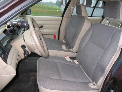 1991 Ford LTD Crown Victoria - Interior view of a 1991 Ford Crown Victoria LTD, showing the front seats and dashboard.
