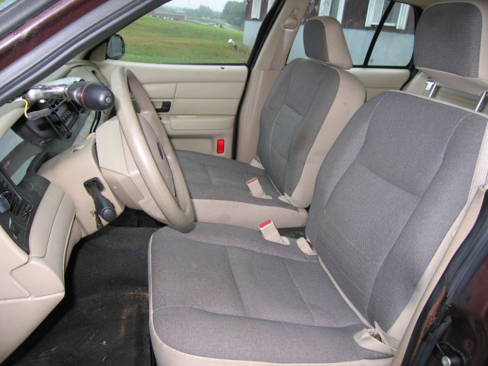 1991 Ford Crown Victoria LTD interior with grey cloth seats, beige door panels, and a tan steering wheel
