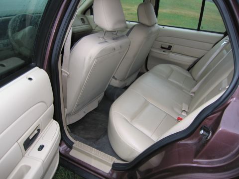 1991 Ford LTD Crown Victoria - Interior view of a 1991 Ford Crown Victoria LTD, highlighting the tan upholstery and door trim.
