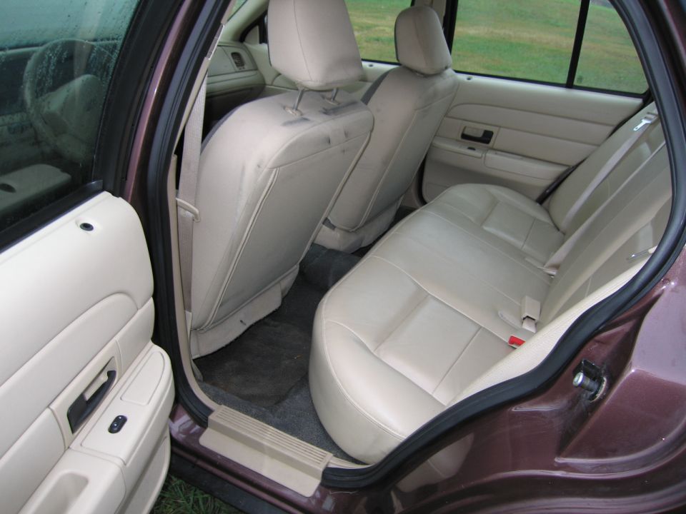 Interior view of a 1991 Ford Crown Victoria LTD showing tan seats and door panels